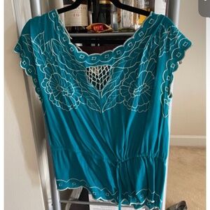Dark teal top with white floral embroidery